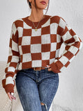 Dark brown loose fit acrylic pullover sweater with a chessboard plaid pattern and long sleeves.