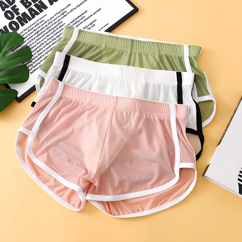 Men's black ice silk mesh boxer briefs with a low waist design on a plain background.