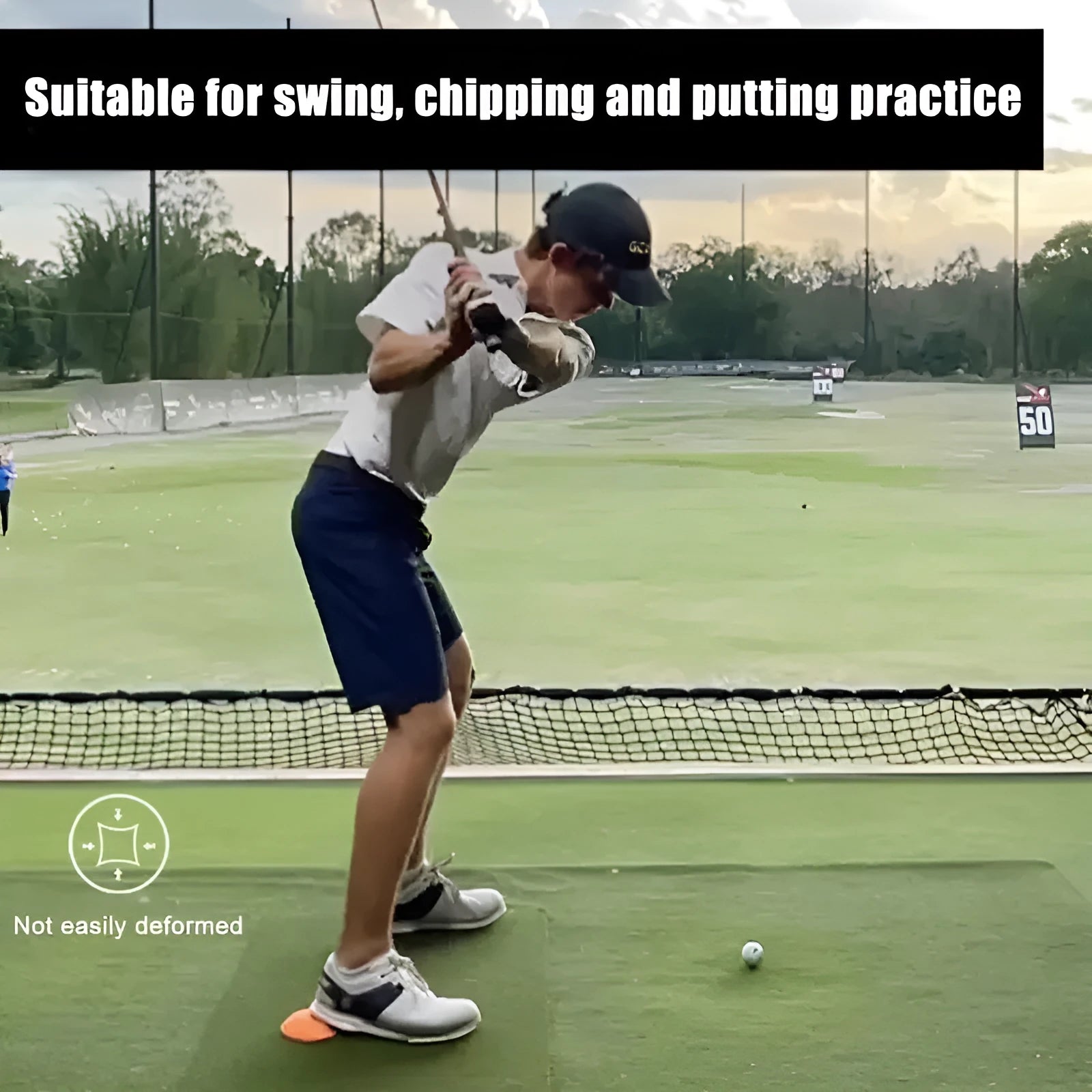 Orange golf centre of gravity training mat on practice surface