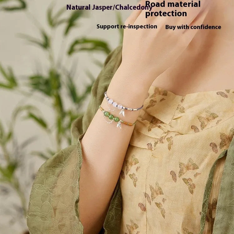 Hetian jade diamond-shaped bracelet with lotus seedpod design and woven carrying strap in light green or haze blue colour options