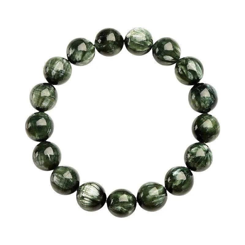 Natural green dragon crystal bead bracelet with geometric ruyi pattern on white background.