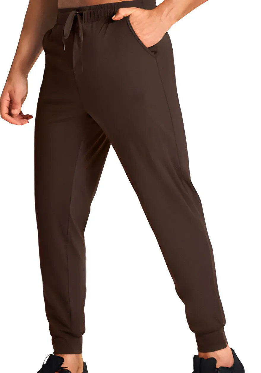 Man wearing loose-fit solid colour casual trousers in a leisure setting.