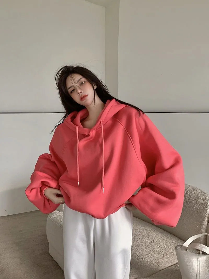 Watermelon red mulberry silk women's hooded sweater in loose pullover style.