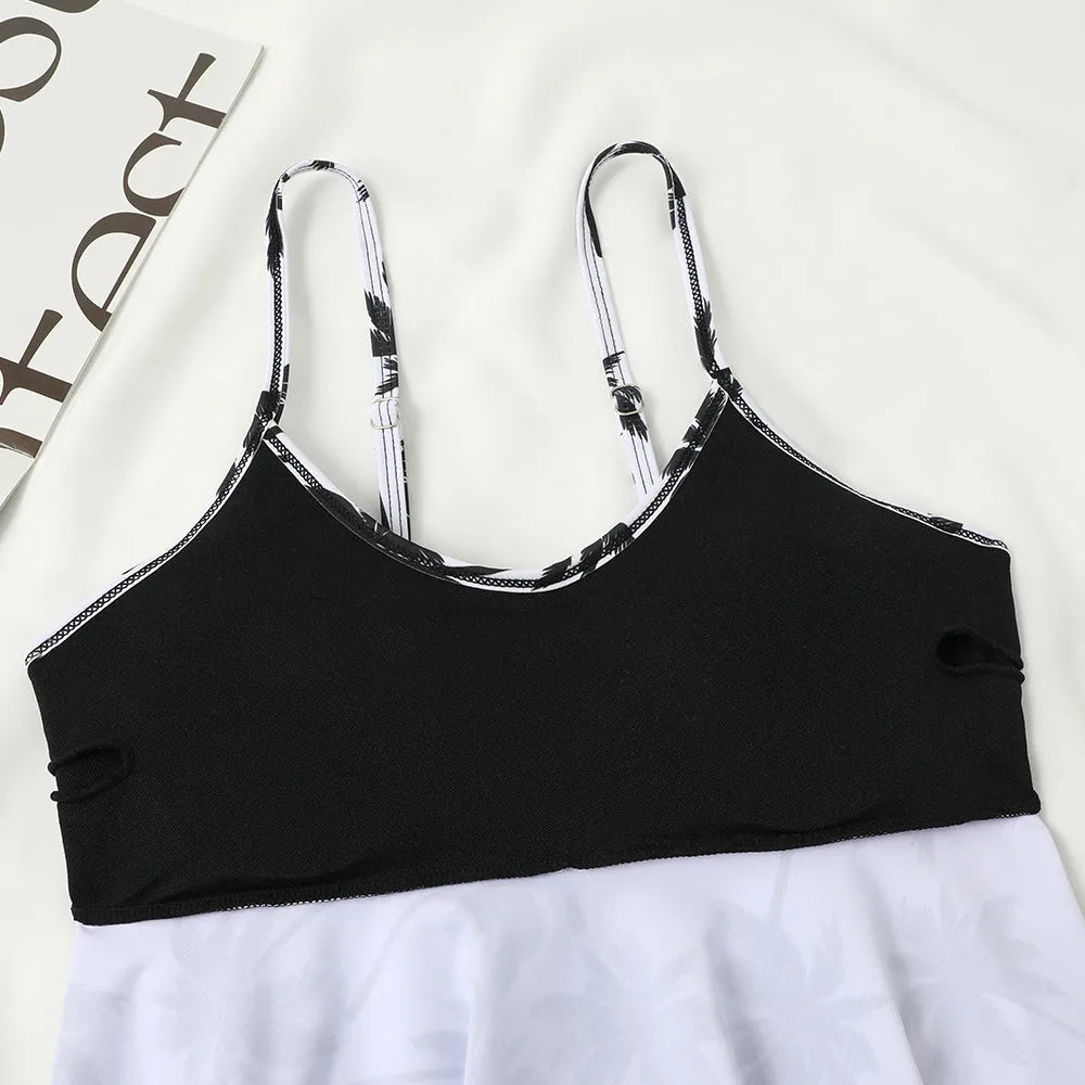 Black high-waisted double-layer swimsuit briefs and sleeveless top laid flat, with a coconut tree print variation.