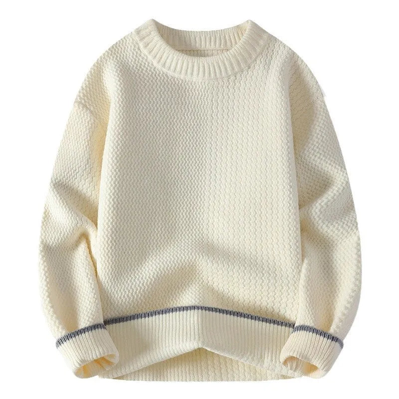 Man wearing a grey loose-fit round neck knitwear pullover sweater for casual autumn wear.