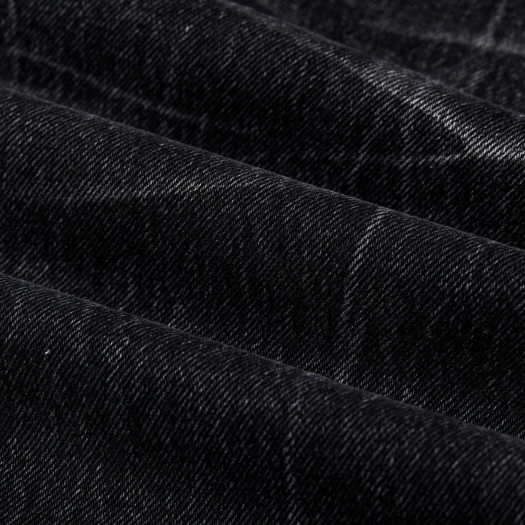 Men's black straight-leg jeans with lightning crack distressing on cotton denim