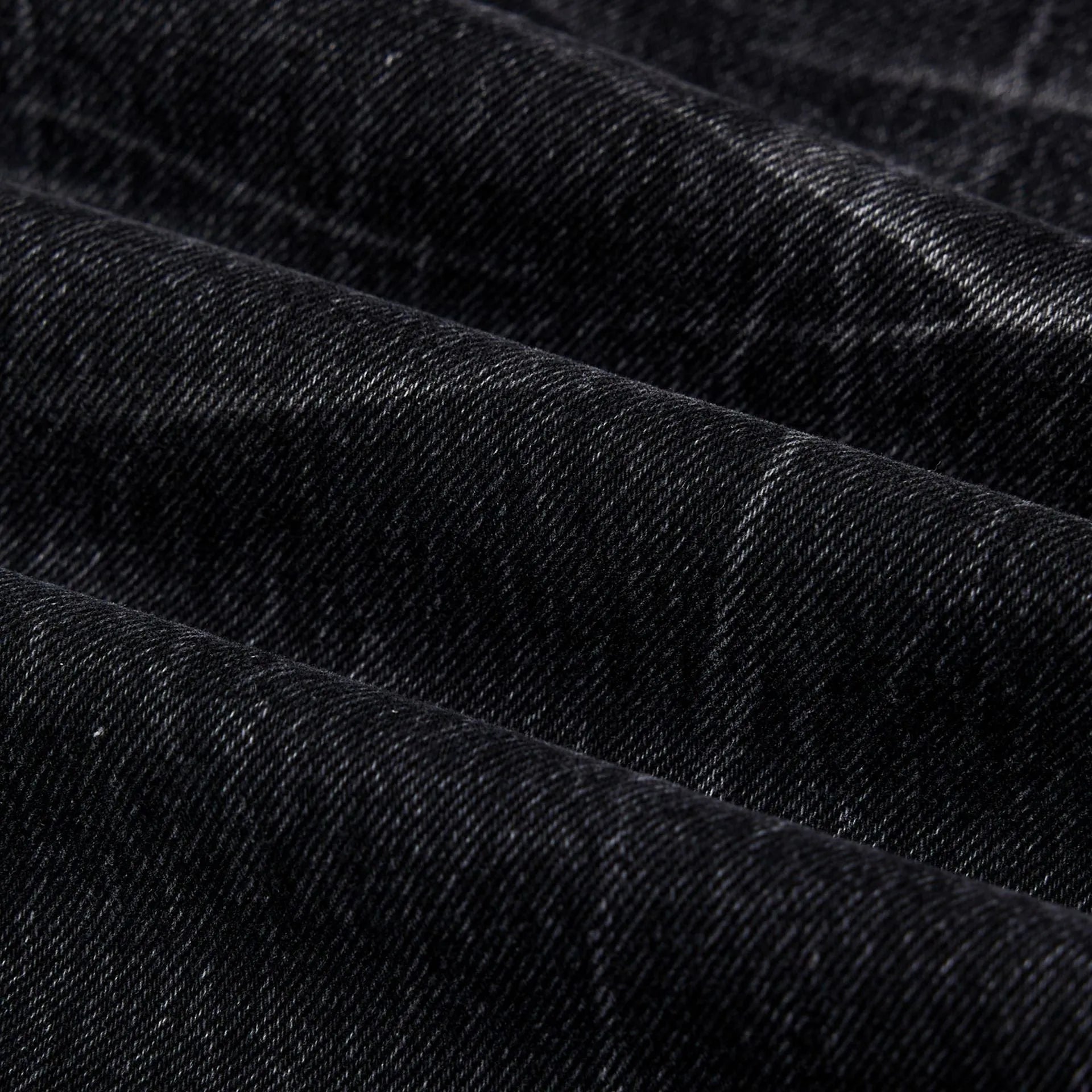 Men's black straight-leg jeans with lightning crack distressing on cotton denim