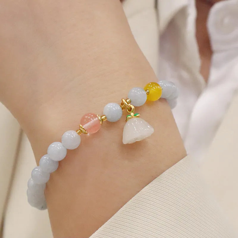 Women's gold-plated bracelet with artificial crystal and chalcedony pendant in climbing cat design