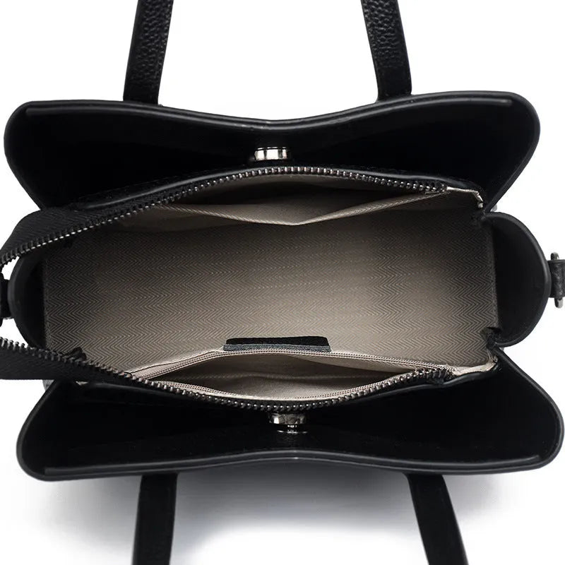 Women's cowhide leather large capacity handbag in horizontal square shape with single shoulder strap.