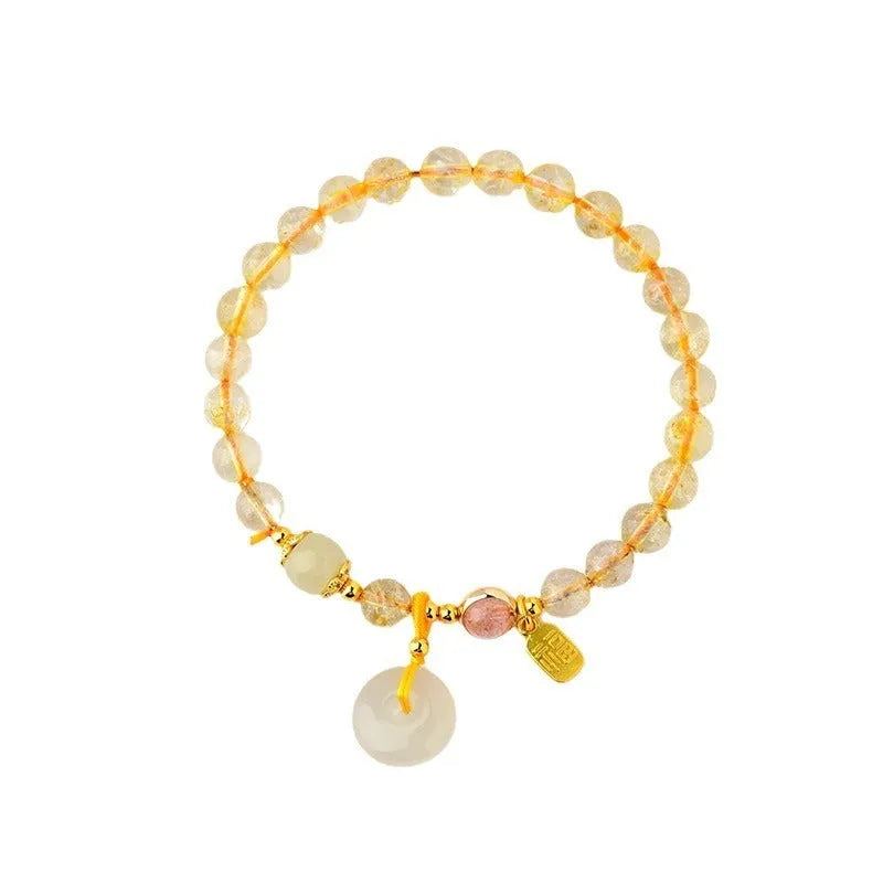 Gold rutilated quartz crystal bracelet with geometric design and safety buckle