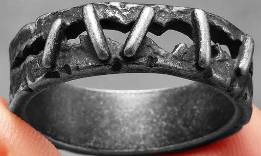 A dark stainless steel double ring with punk-inspired stitching detail on the band.