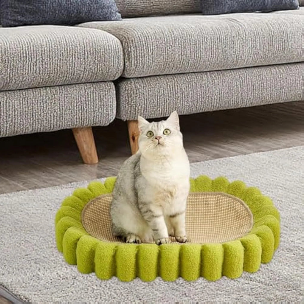 Green oval cat scratcher pad with sisal material and integrated cat bed bowl design