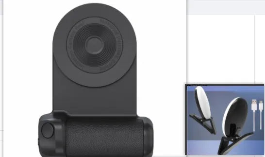Black multifunctional phone camera holder with magnetic suction and rotatable stand on a table.