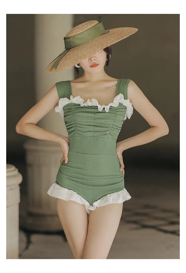 Korean-style high-waist one-piece swimsuit in black, pink, or green on a model