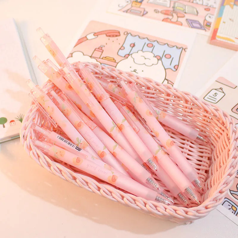 Cute Peach press gel pen with 14cm plastic body and rollerball tip against white background