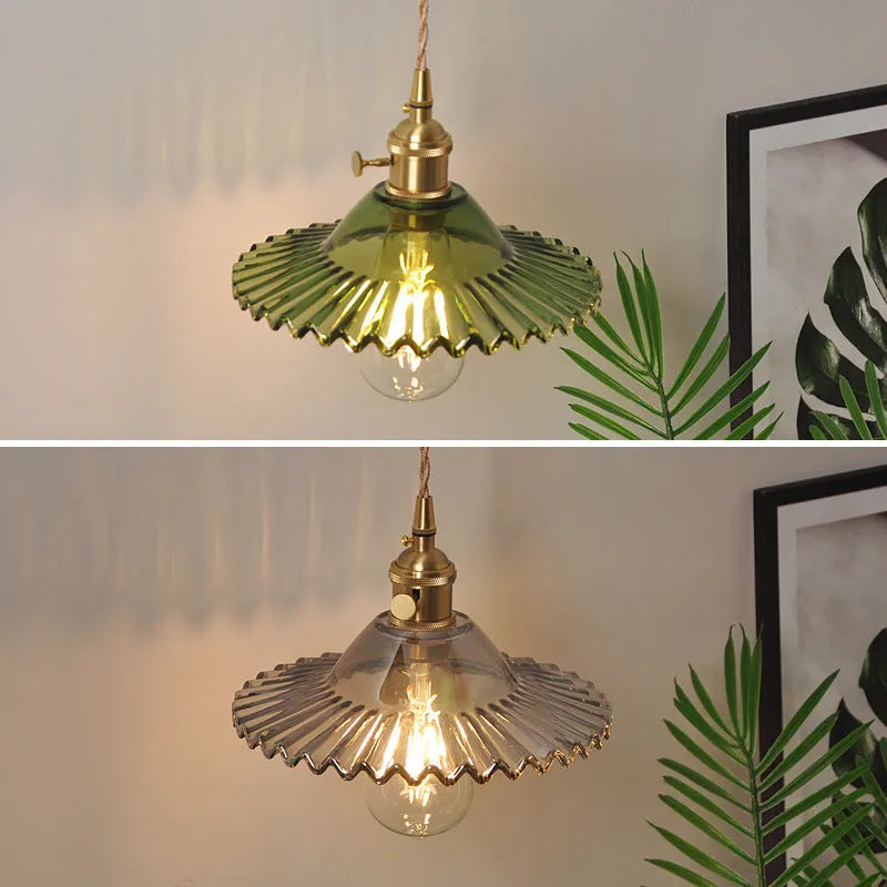 Retro brass lotus wall lamp with adjustable copper wire and white glass shade mounted on a wall.