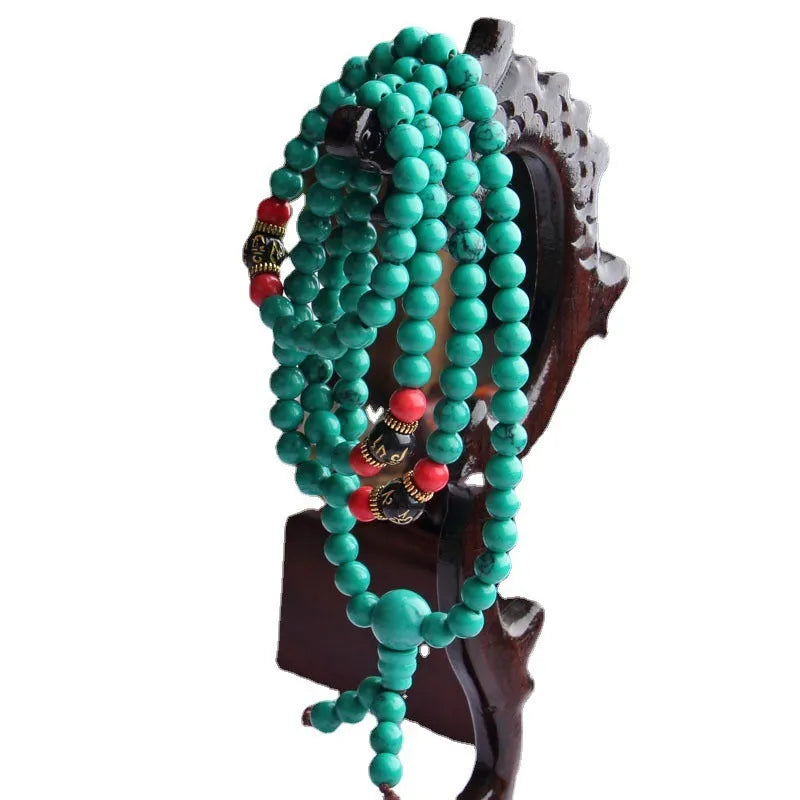 Turquoise Tibetan bracelet with 108 polished beads in synthetic stone