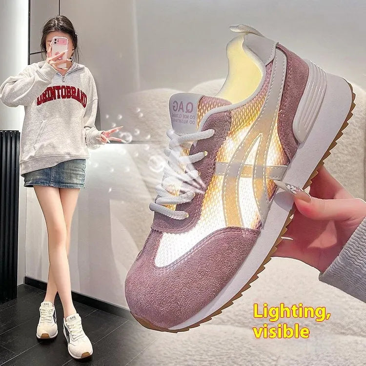 Women's white casual lace-up sneaker with non-slip sole on neutral background