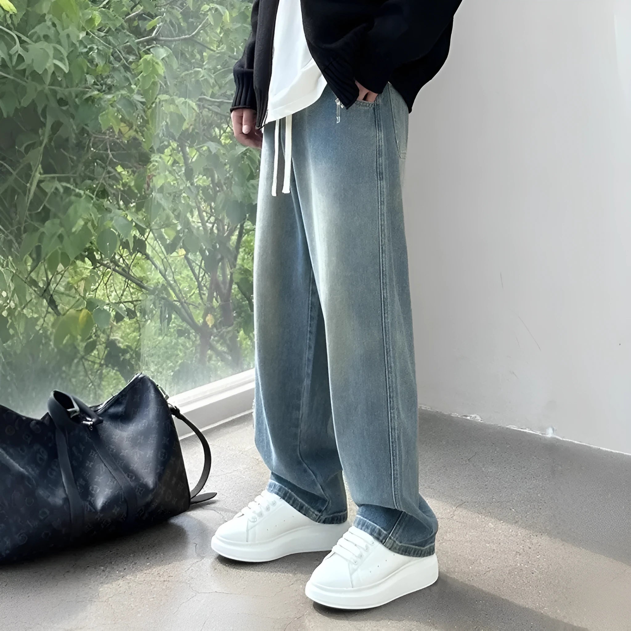 Men's straight-leg blue jeans with drawstring waist on mid-waist cut