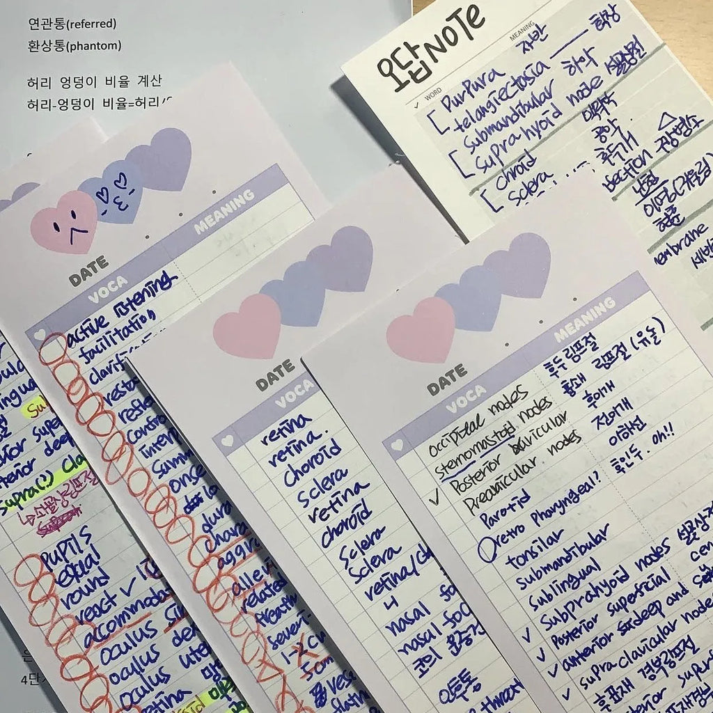 Vertical B5 half-size notepad with English words printed on paper, shown in pink, purple, and blue cover colours.