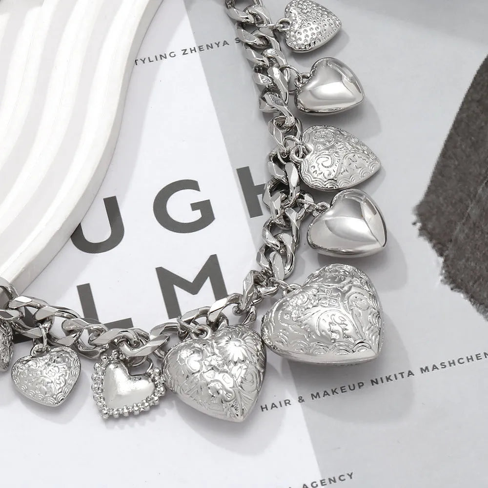 Exaggerated carved heart-shaped alloy pendant necklace on an adjustable metal chain.