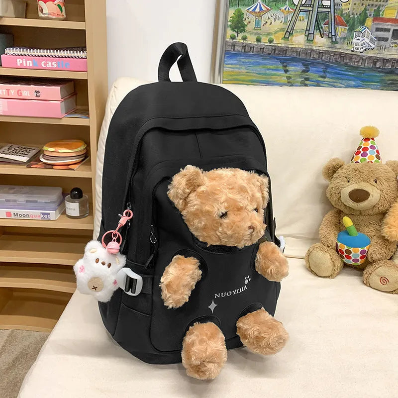 Nylon school backpack in macaron colours with curved shoulder straps and literary style design.