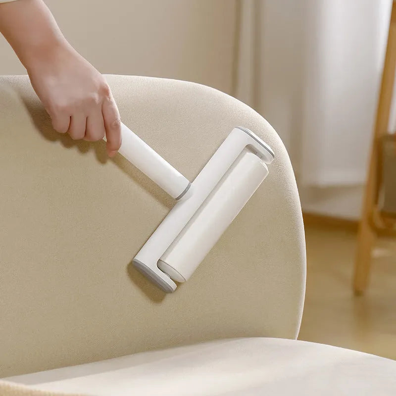 Handheld lint remover roller with tearable paper stick for removing pet hair from floors and furniture