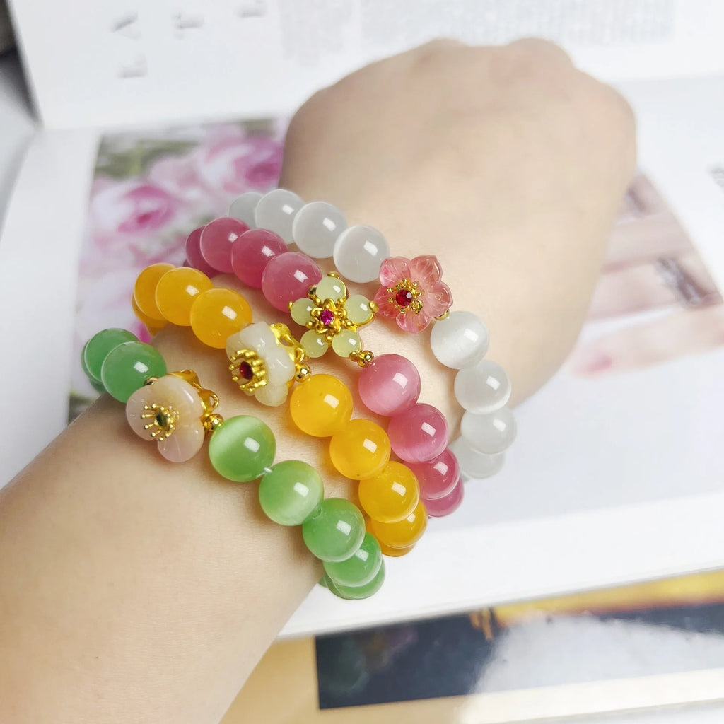 Women's handmade glass beaded bracelet with floral design in yellow, pink, white, or green colours