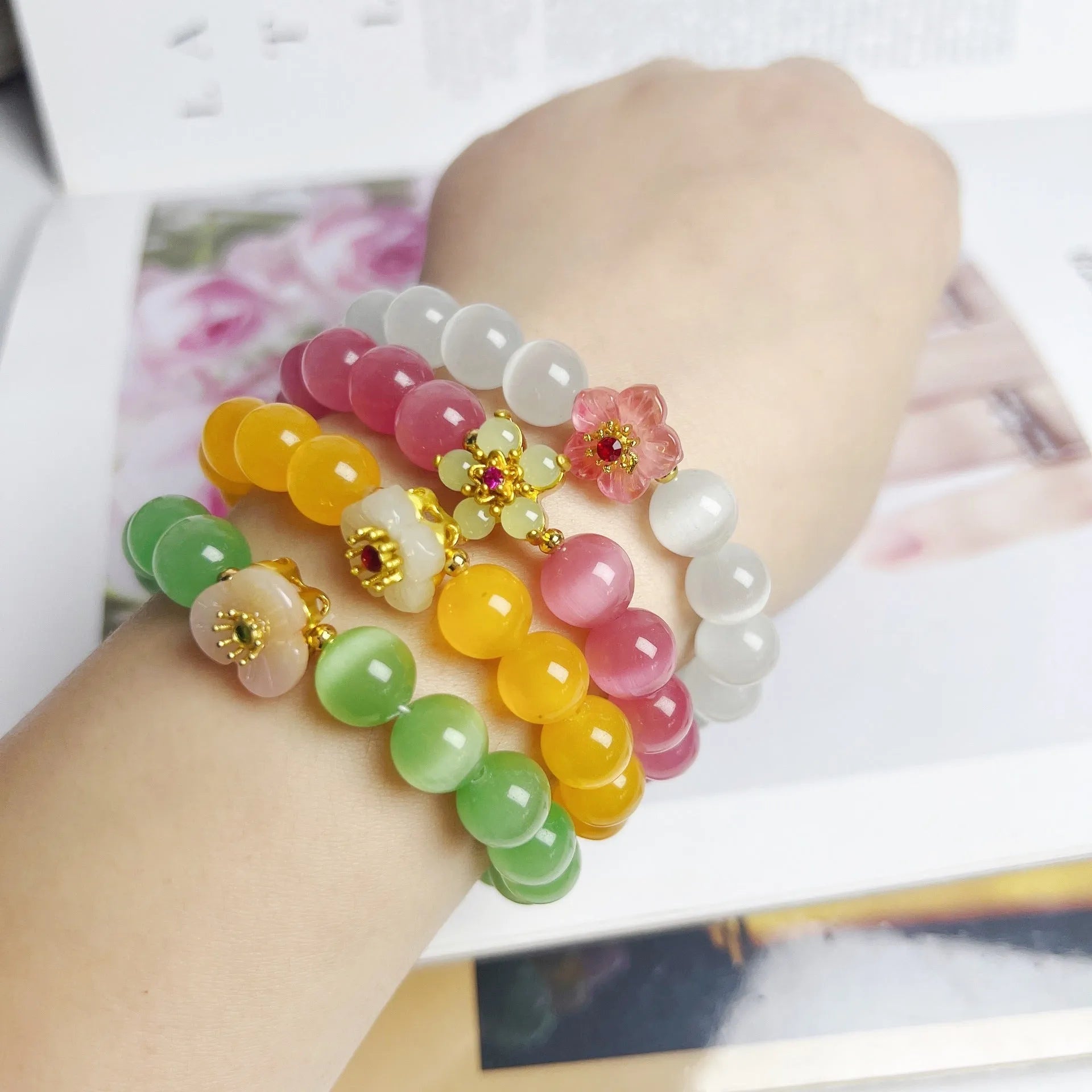 Women's handmade glass beaded bracelet with floral design in yellow, pink, white, or green colours