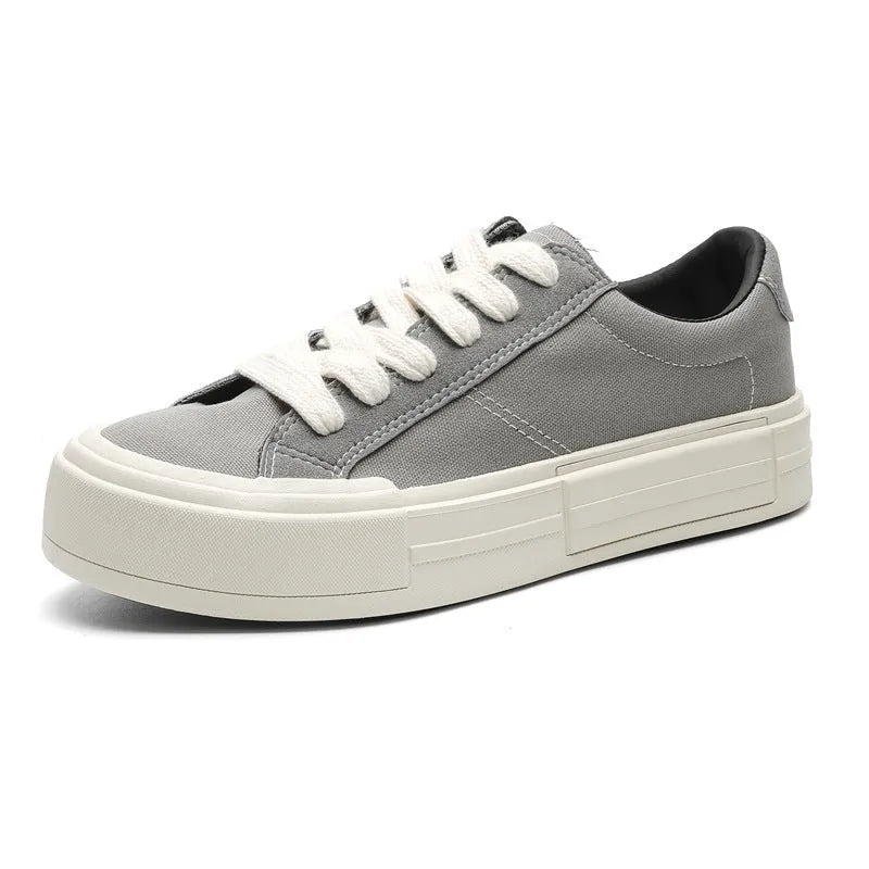 Canvas platform casual skate shoes with lace-up, tassel detail, and rubber sole in black and gray