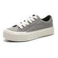 Canvas platform casual skate shoes with lace-up, tassel detail, and rubber sole in black and gray