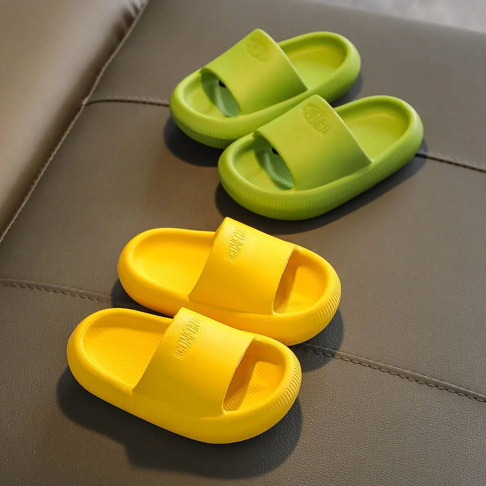 Children's mixed colour EVA slippers with textured non-slip soles and 1.5cm thick cushioning.