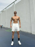 Men's ice silk nylon quick-drying double-layer casual shorts in quarter length.