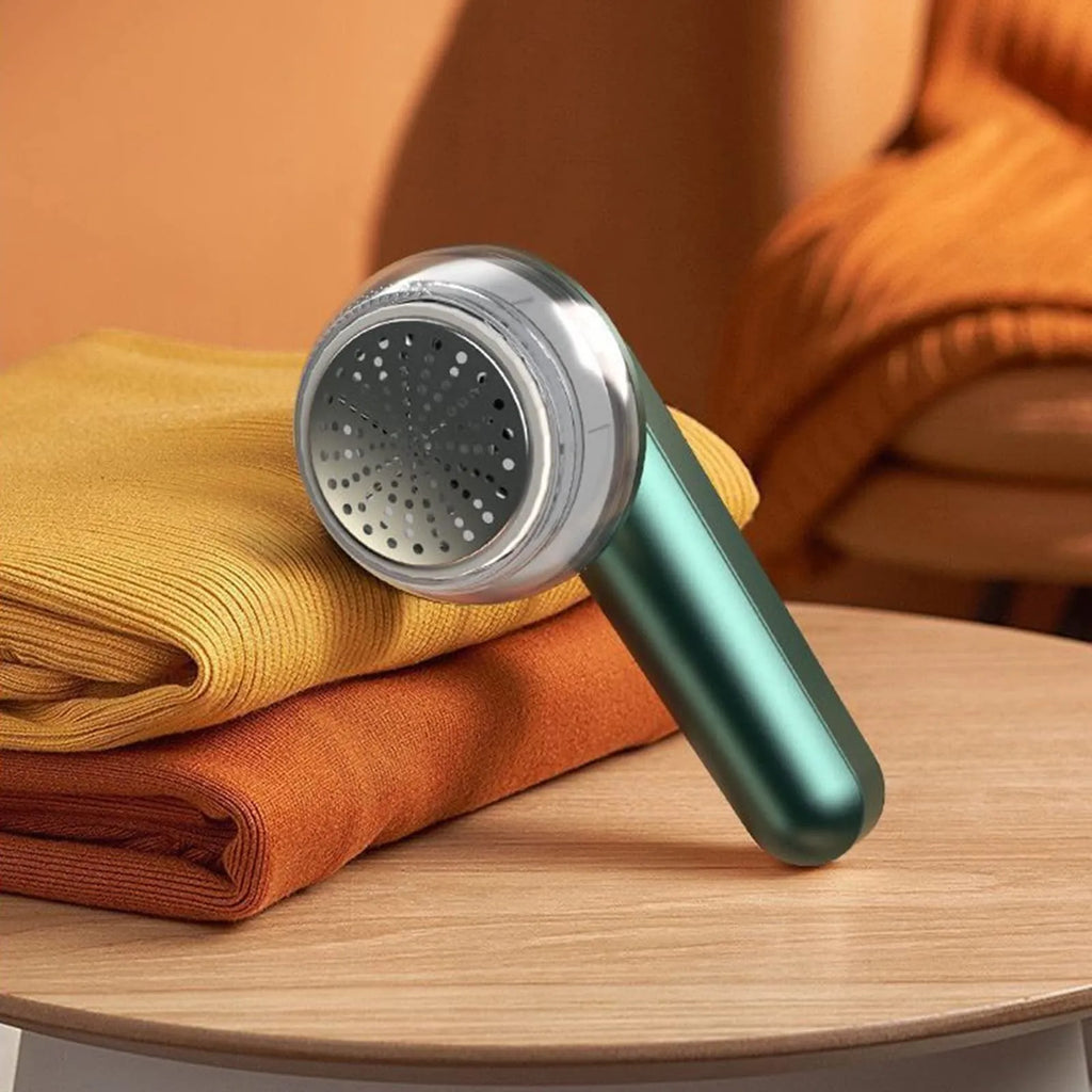 Green and white USB rechargeable electric lint remover with removable lint collector container.