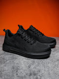 Unisex casual sports shoes with thick EVA sole and mesh upper in black and white colour options