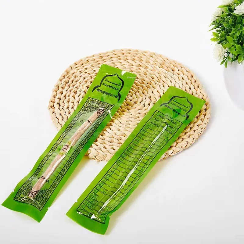 Wooden teeth cleaning stick on bathroom counter for adult oral hygiene