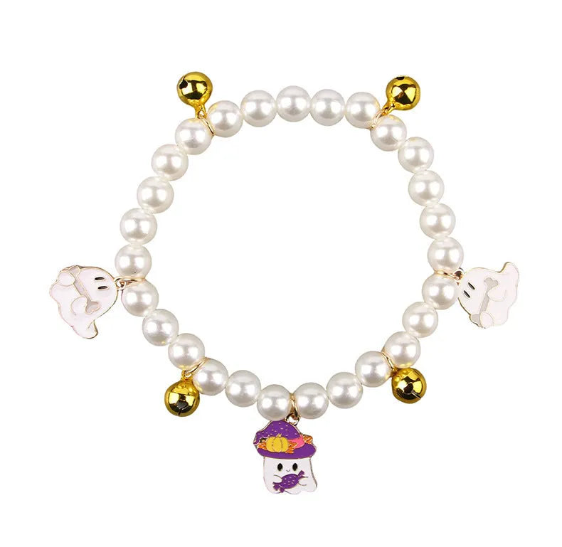 Halloween cat collar decorated with simulated pearls in a pumpkin design on a pet