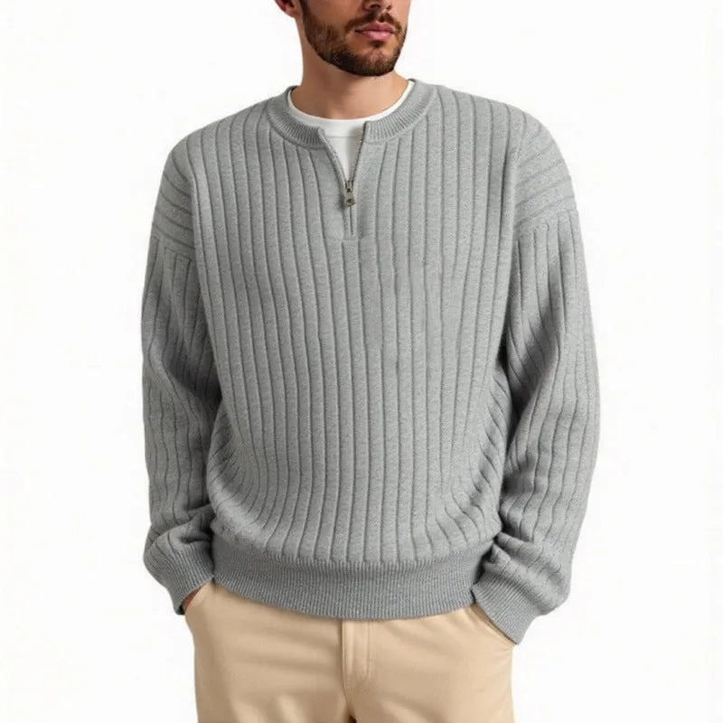 A grey men's textured knit half-zip pullover sweater on a hanger, showing the loose fit and long sleeves.
