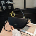 Medium hard PU box saddle bag in solid colour with internal zipper pocket and oval shape