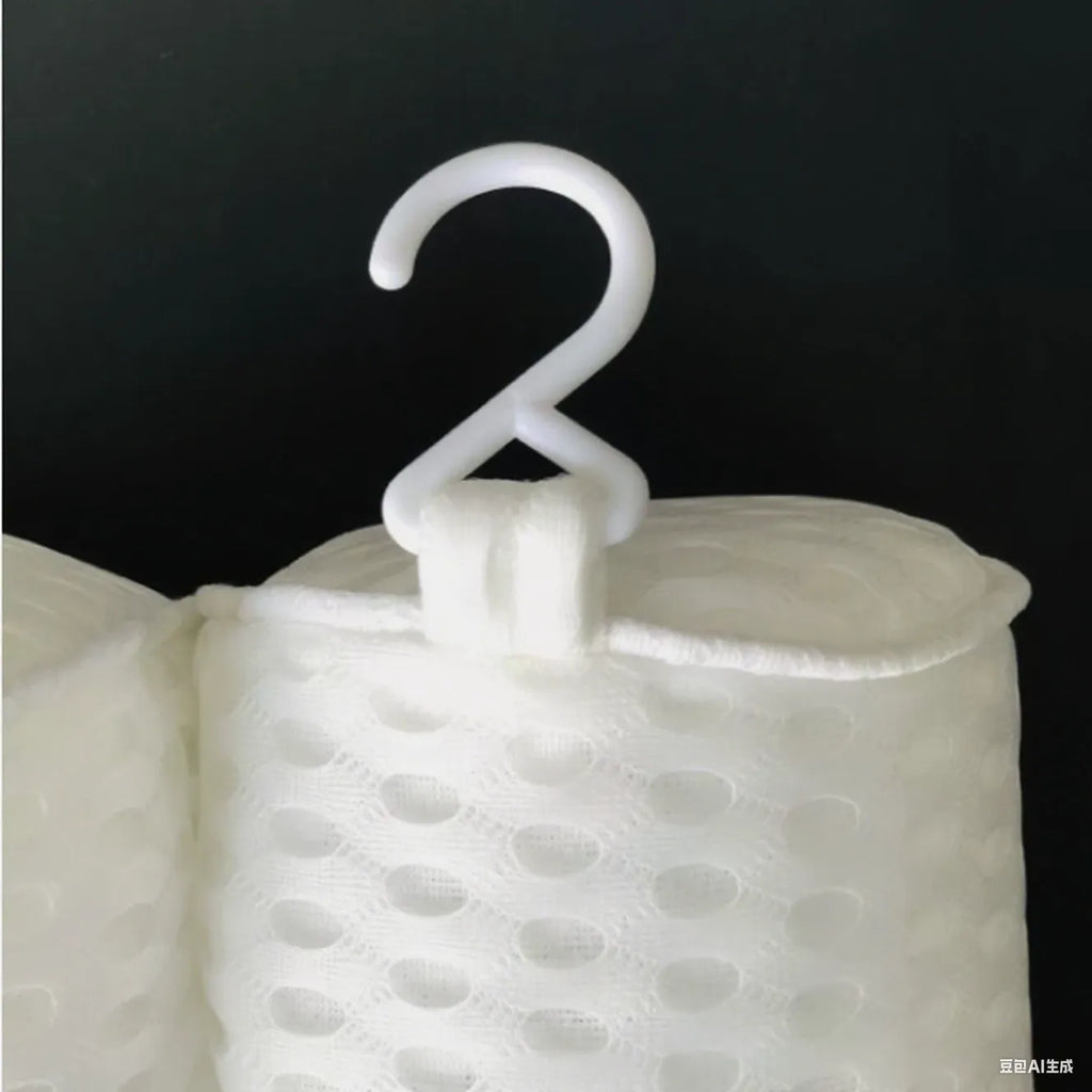 White bathtub pillow with 3D mesh fabric and suction cups on a tub surface.