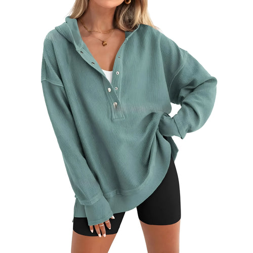 Women's solid colour loose-fit pullover sweater with raglan sleeves in peacock green.