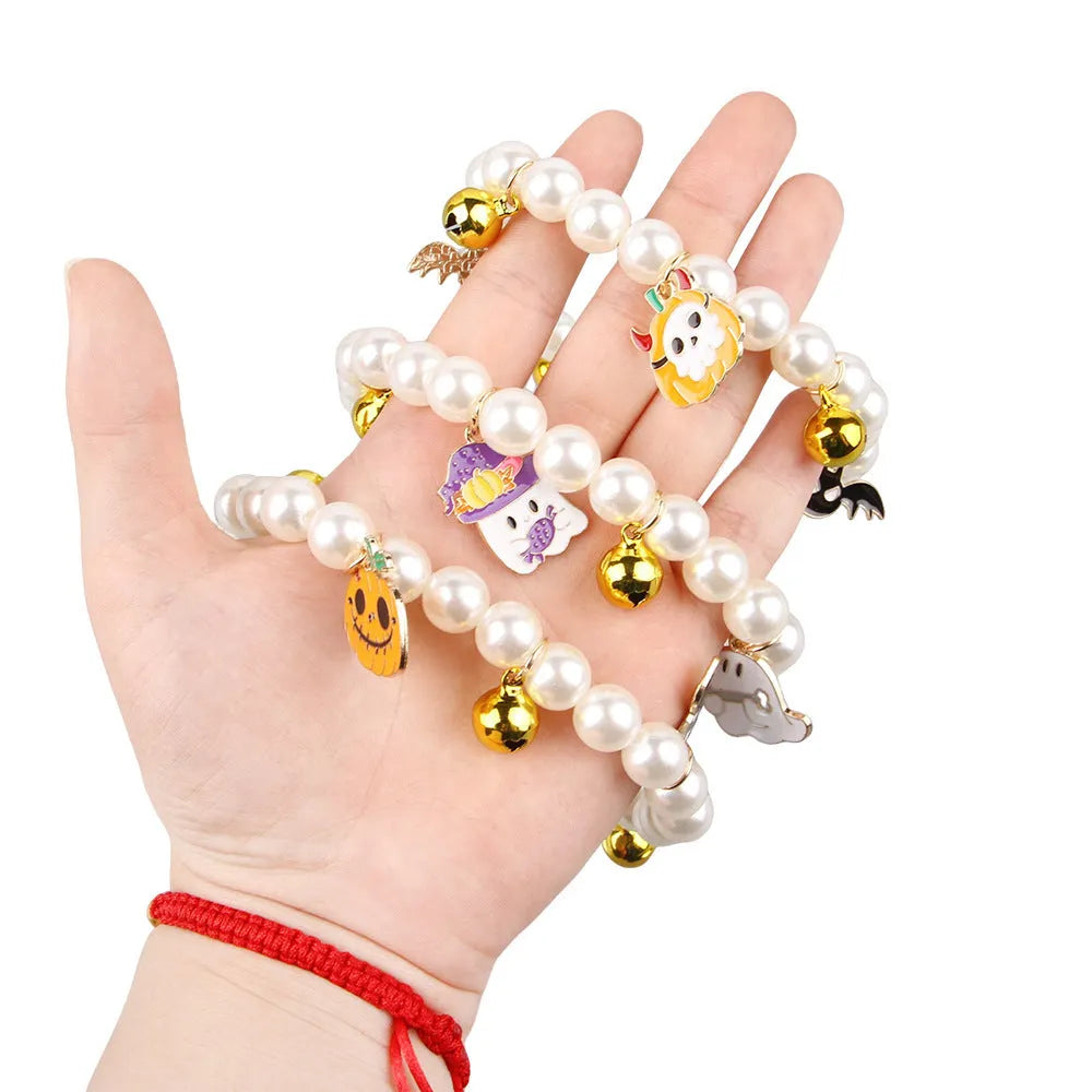 Halloween cat collar decorated with simulated pearls in a pumpkin design on a pet