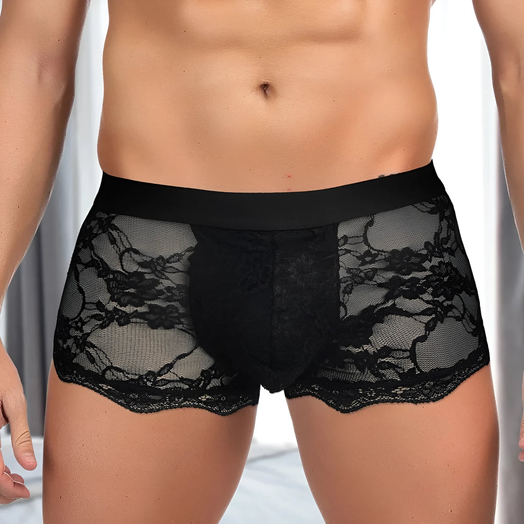 Men's black lace briefs with hollow out see-through design showing fabric texture