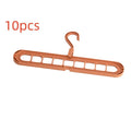 Plastic folding hanger with nine holes for trousers in beige, blue, green, grey, or pink colours.