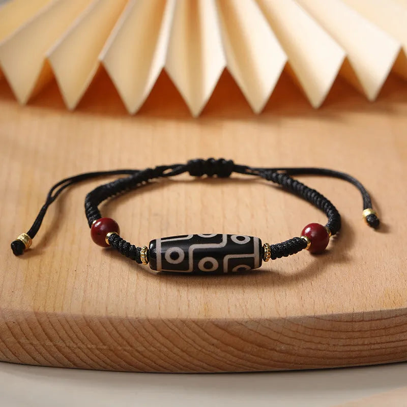 Men's Tibetan agate Dzi bead bracelet with shrinkable adjustable closure showing traditional couple style beadwork