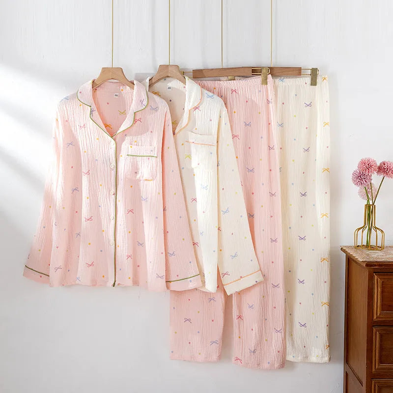 Women's long sleeve cotton pyjama set in pink, featuring a casual top and trousers.