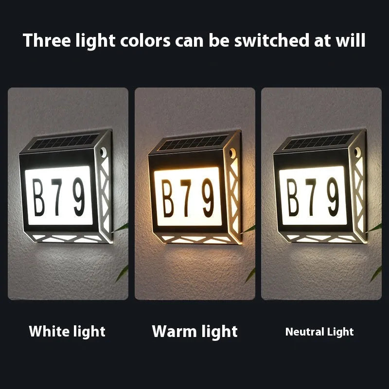 Solar powered waterproof doorplate light with LED illumination in black or silver finish