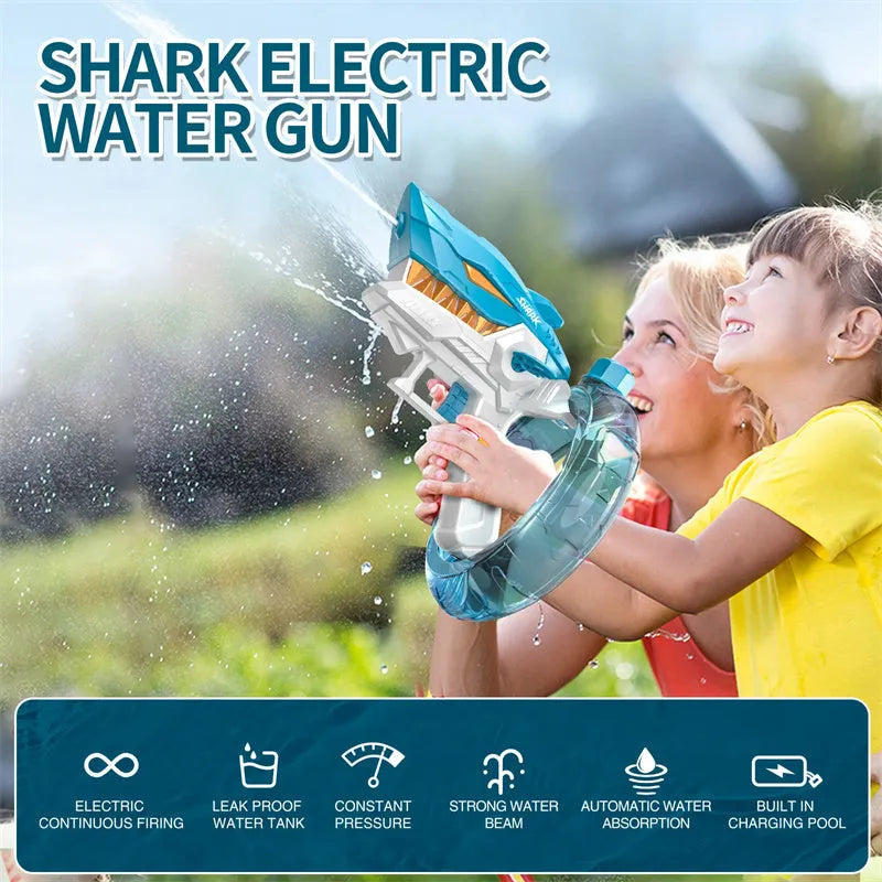 Blue Shark-shaped electric water gun toy with large tank on a sandy beach