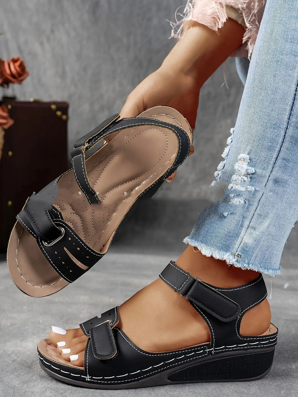 Women's beige thick-soled sandals with adjustable black Velcro straps on a white background.