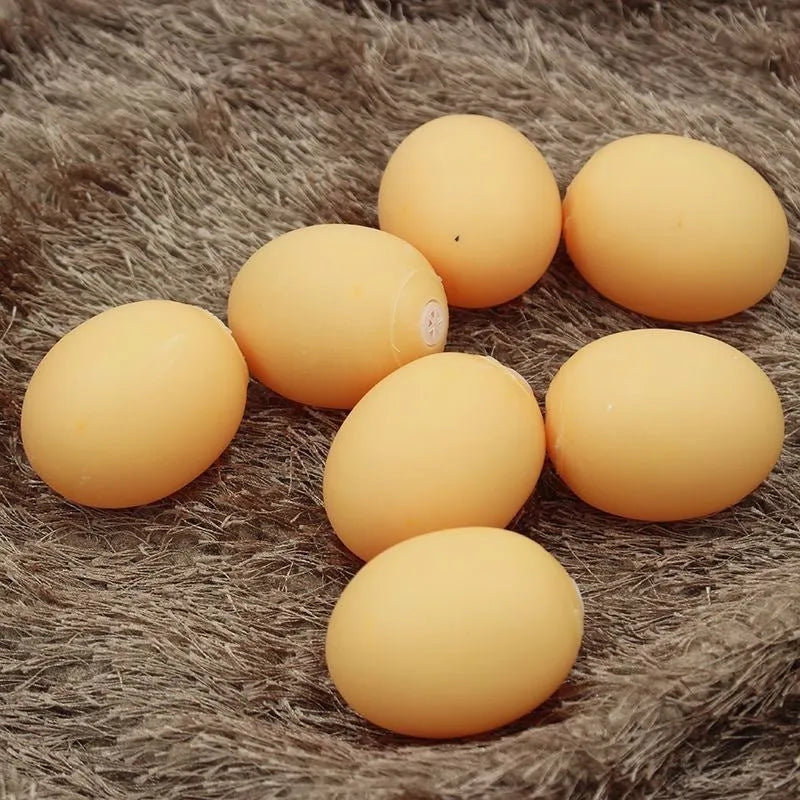 Realistic egg-shaped dog chew toy with textured surface and sound-emitting features for interactive pet play